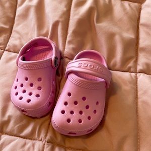Pink Crocs size C4. Lightly worn.